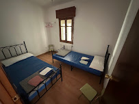 Cozy private room with two single beds and wooden window